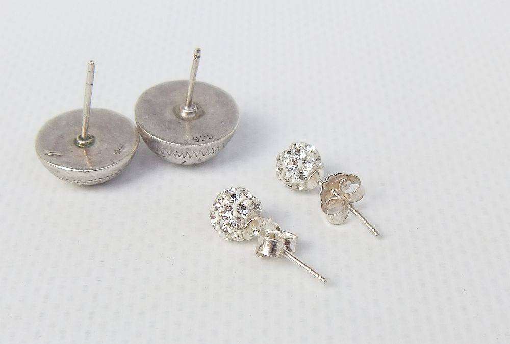 A pair of sterling silver dome earrings and sterling silver studs with faceted insets