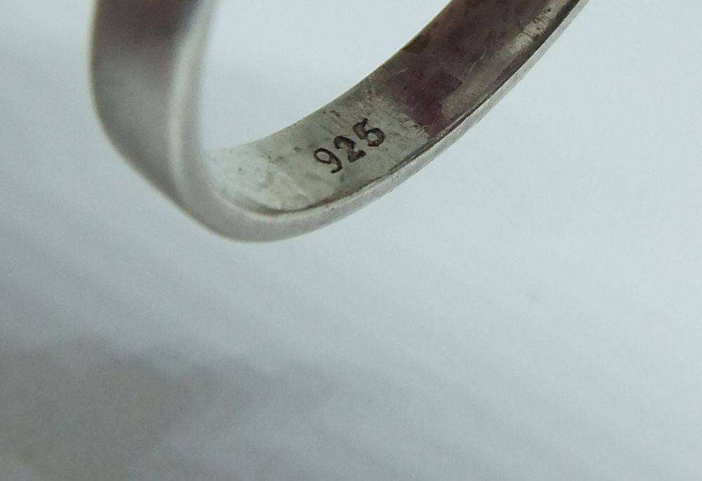 A unique adjustable sterling silver ring set with genuine coral