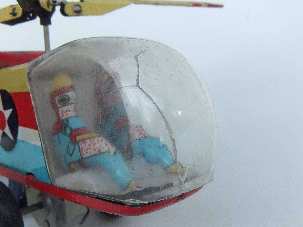 A very cool vintage Chinese lithograph friction powered tinplate helicopter with original box