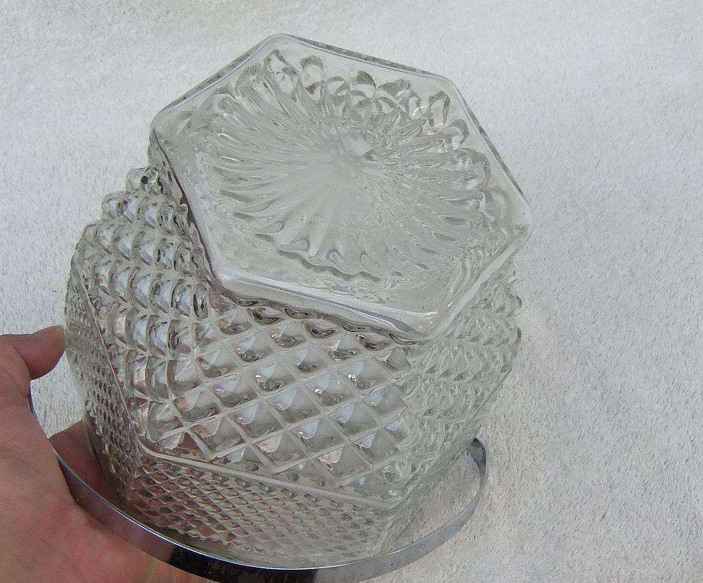 A large vintage molded glass cookie jar with metal handle