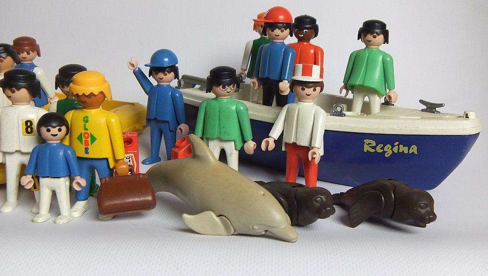 Thirty two pieces of vintage Playmobil toys including animals , boats and accessories