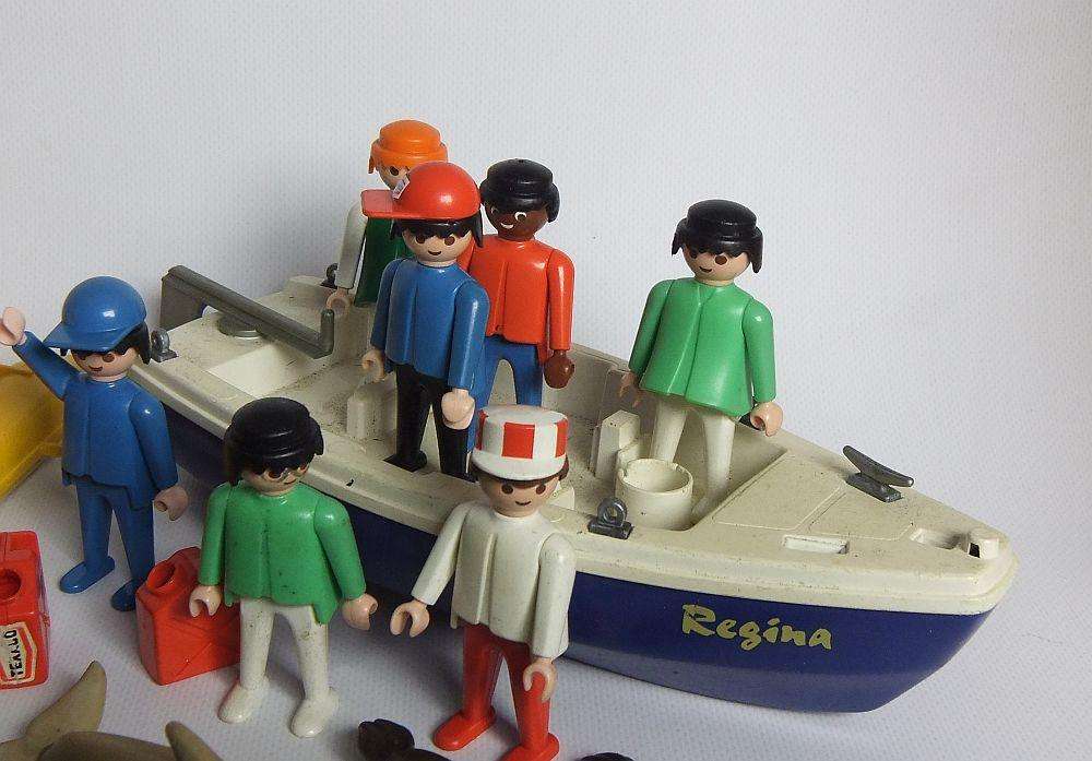 Thirty two pieces of vintage Playmobil toys including animals , boats and accessories