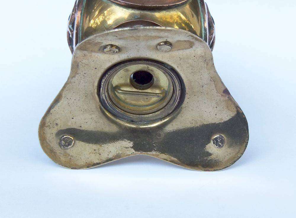 A vintage brass and copper miniature divers helmet ornament with hidden sharpener plus compass