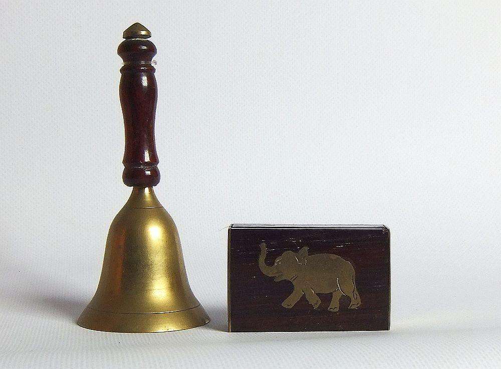 A vintage brass bell with wooden handle and wooden box with brass fittings and inlay