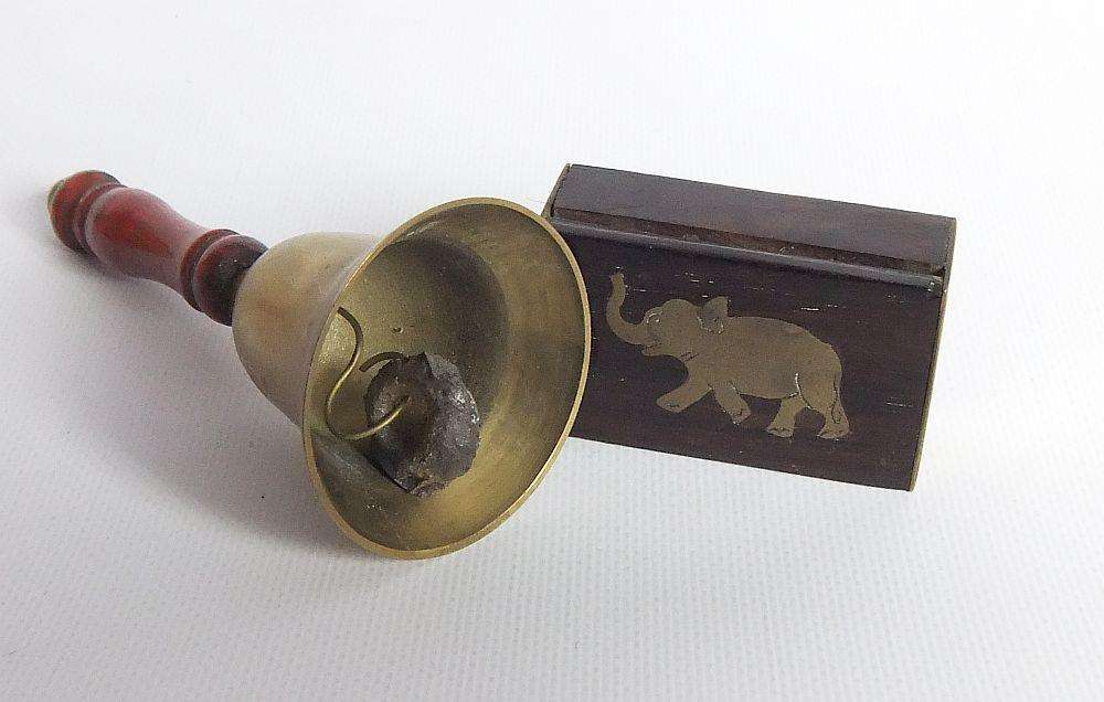 A vintage brass bell with wooden handle and wooden box with brass fittings and inlay