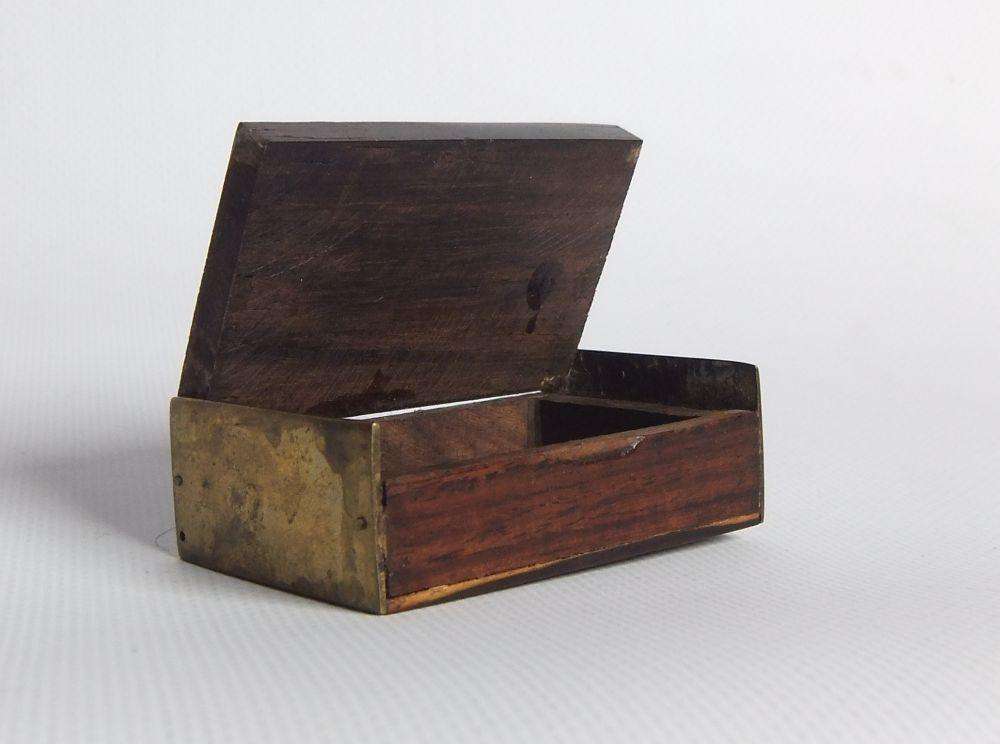 A vintage brass bell with wooden handle and wooden box with brass fittings and inlay