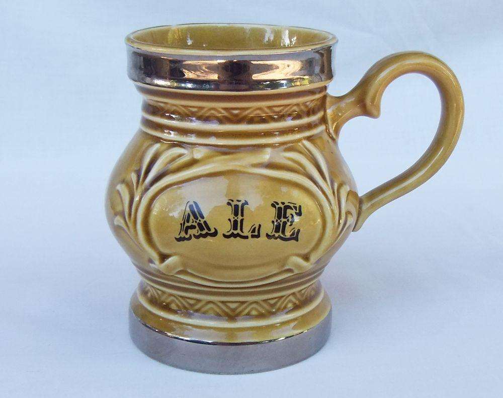 A vintage Wade porcelain jug with ALE motif