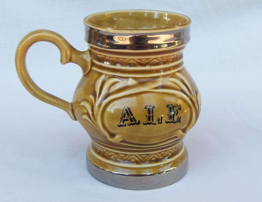 A vintage Wade porcelain jug with ALE motif