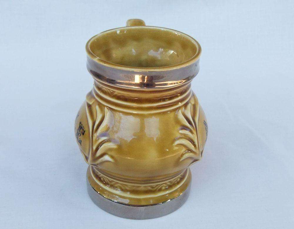 A vintage Wade porcelain jug with ALE motif