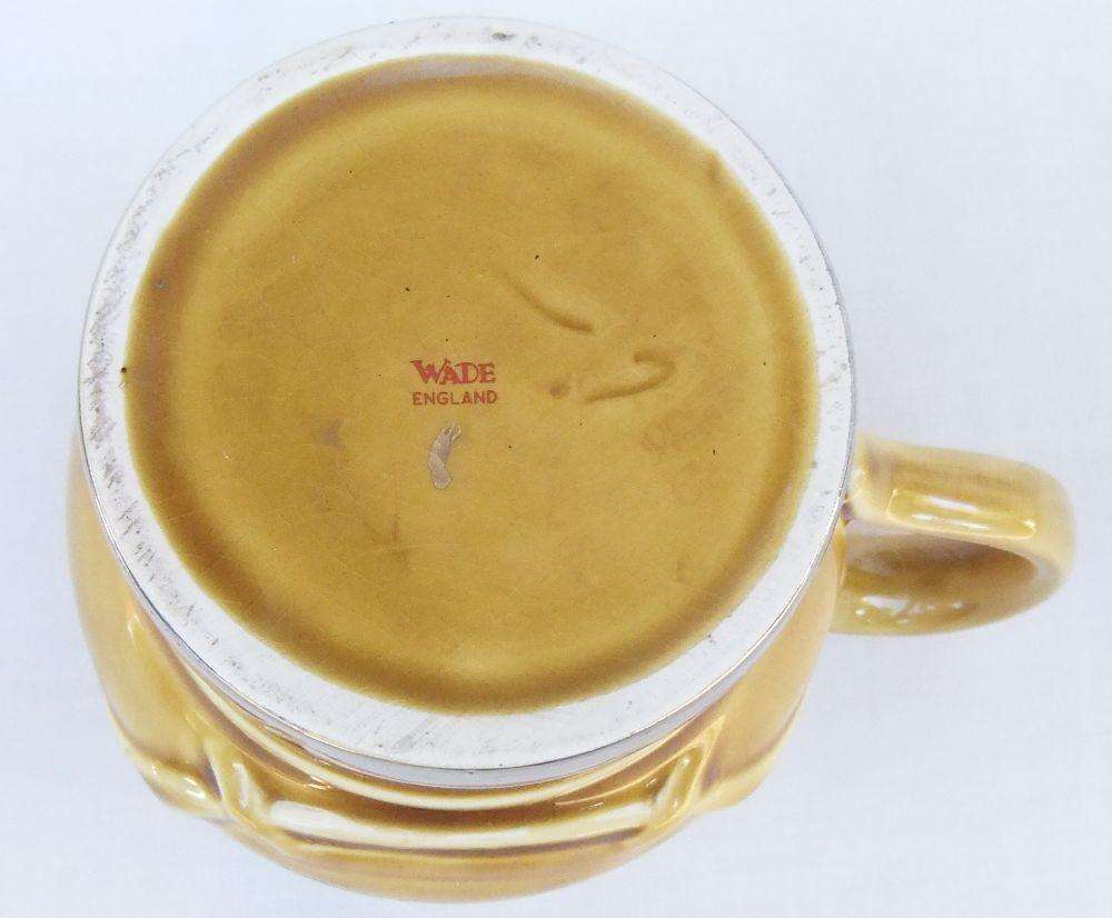 A vintage Wade porcelain jug with ALE motif