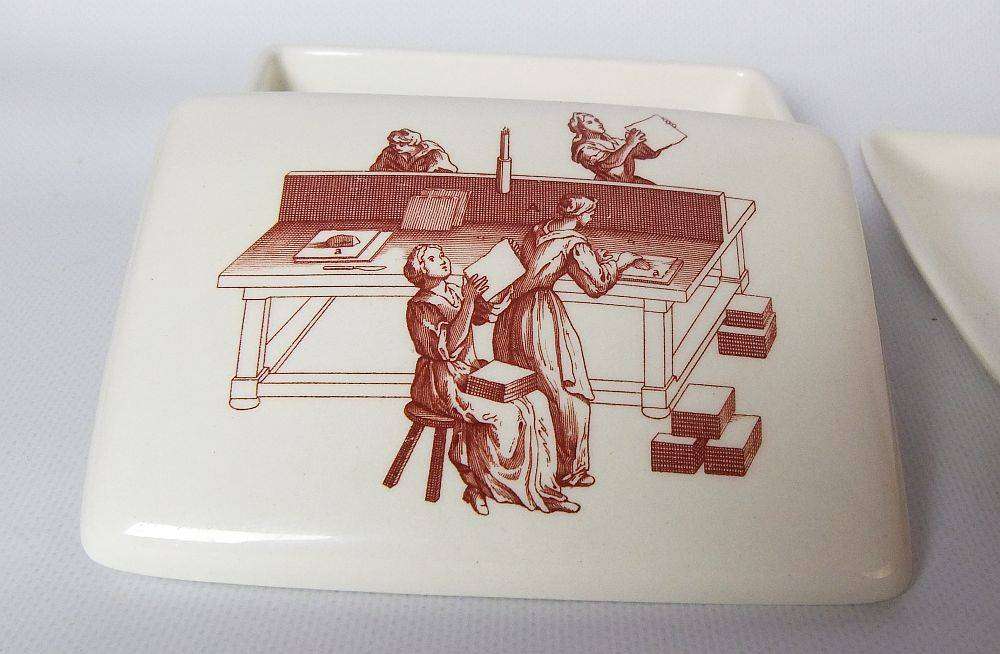 A vintage lidded porcelain cheese or butter dish by Wedgwood England depicting papermakers