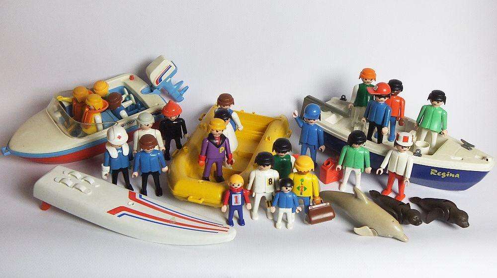 Thirty two pieces of vintage Playmobil toys including animals , boats and accessories