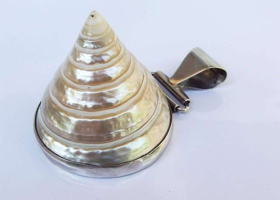 An exquisite unique Throchius Mother of Pearl pyramid top sea shell pendant set in sterling silver