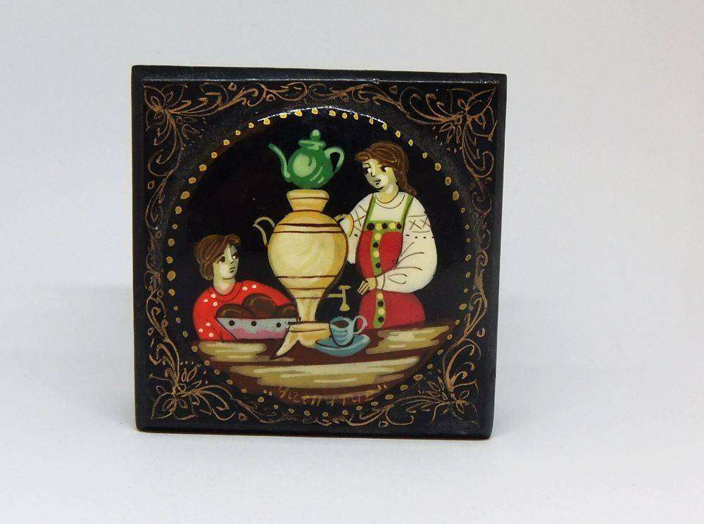 A vintage Russian hand painted and signed trinket box with feast motif in excellent condition