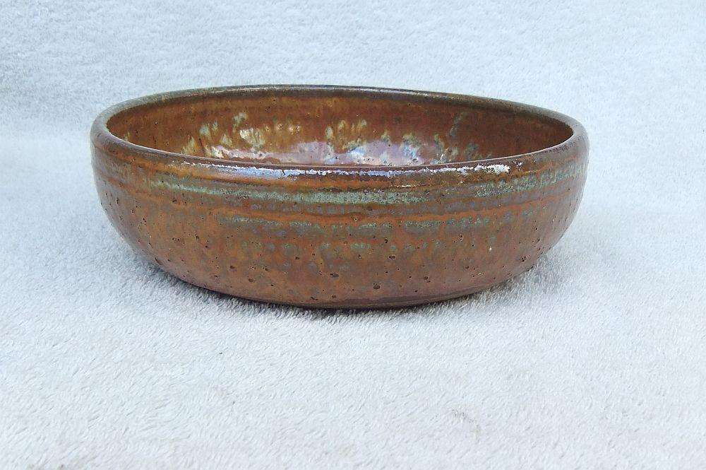 A large pottery serving bowl with makers stamp possibly by Hyme Rabinowitz