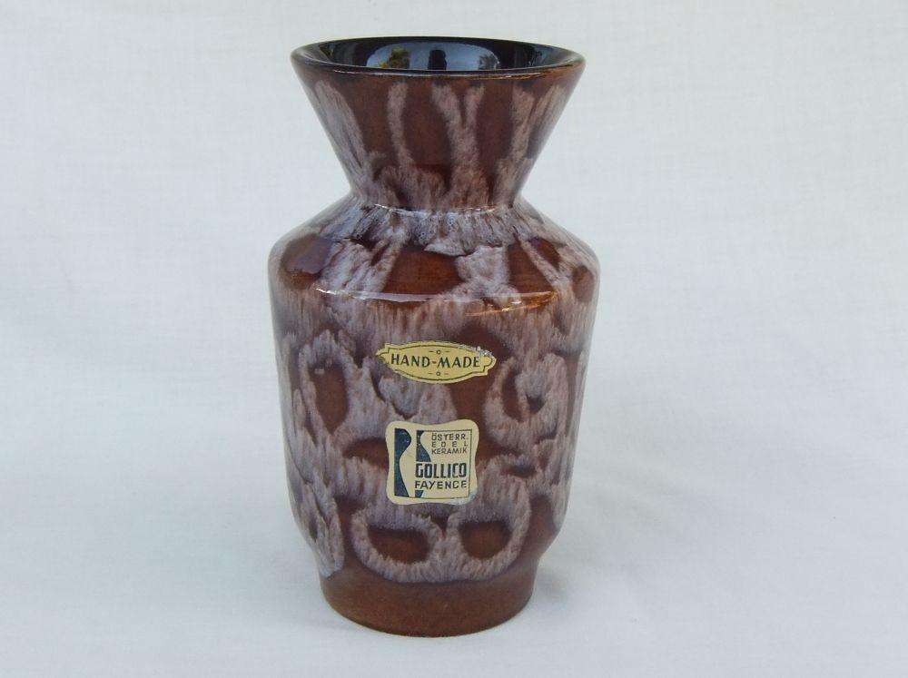 A vintage Austrian pottery vase with original makers tag still attached