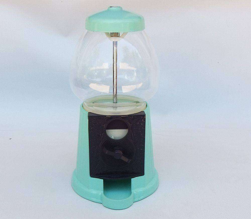 An awesome vintage look , glass , plastic and metal gumball machine in excellent condition