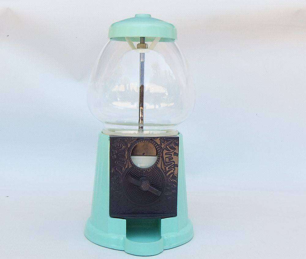 An awesome vintage look , glass , plastic and metal gumball machine in excellent condition
