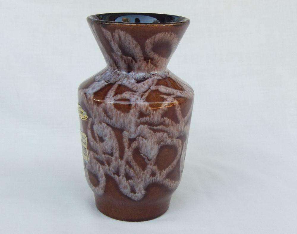 A vintage Austrian pottery vase with original makers tag still attached