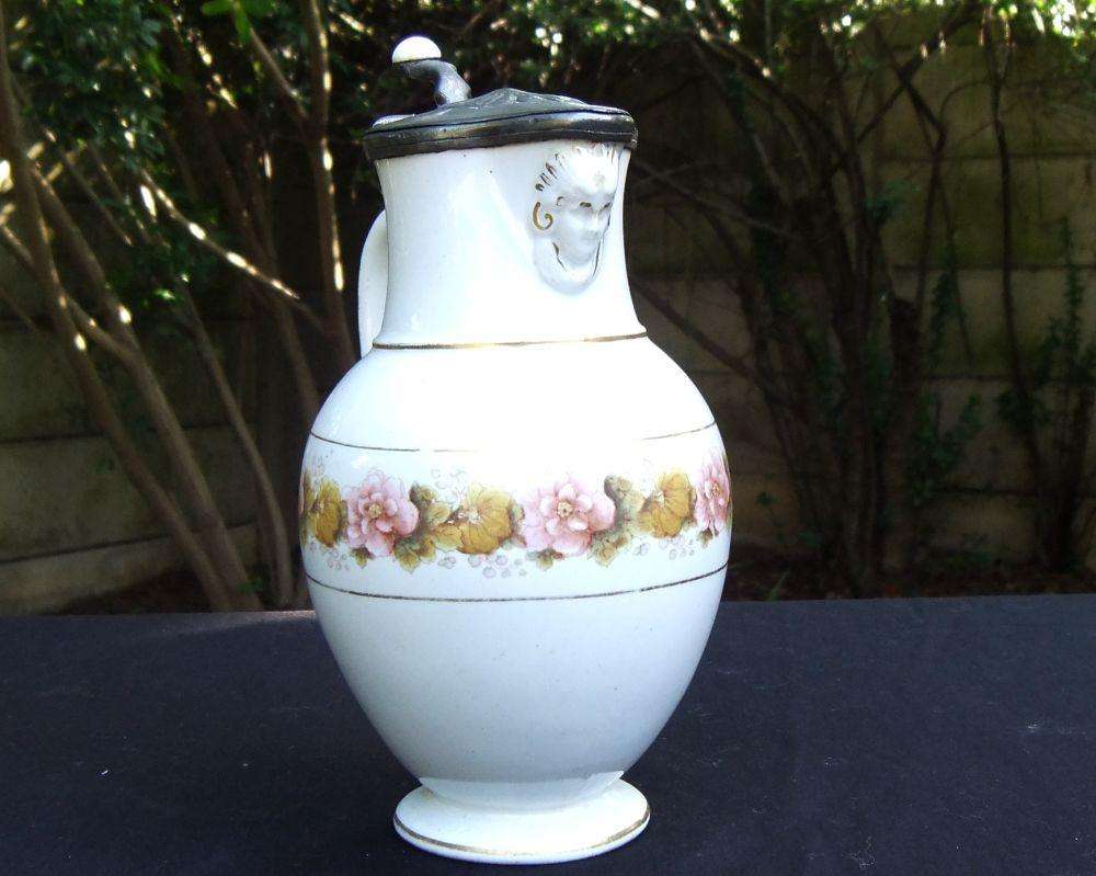 A rare antique mid 1800`s tankard with hinged pewter lid