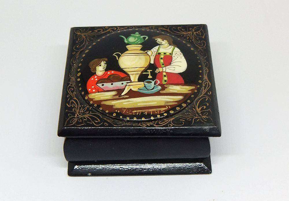 A vintage Russian hand painted and signed trinket box with feast motif in excellent condition