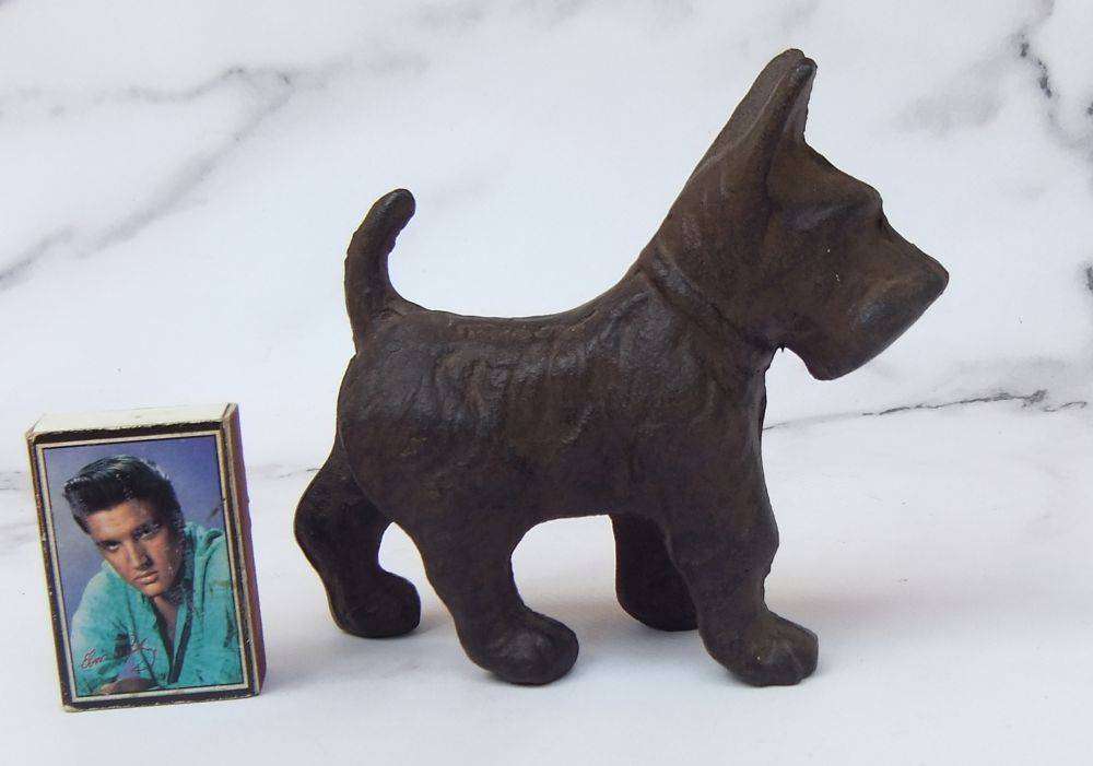 An old cast iron Scottish Terrier deskpiece ornament and paperweight