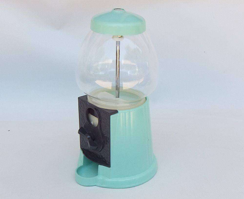 An awesome vintage look , glass , plastic and metal gumball machine in excellent condition