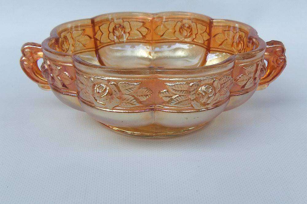 A beautiful old genuine Carnival glass bonbon dish with rose detail