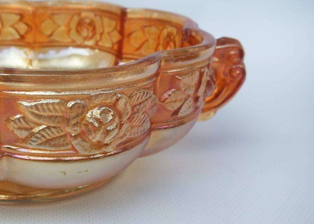 A beautiful old genuine Carnival glass bonbon dish with rose detail