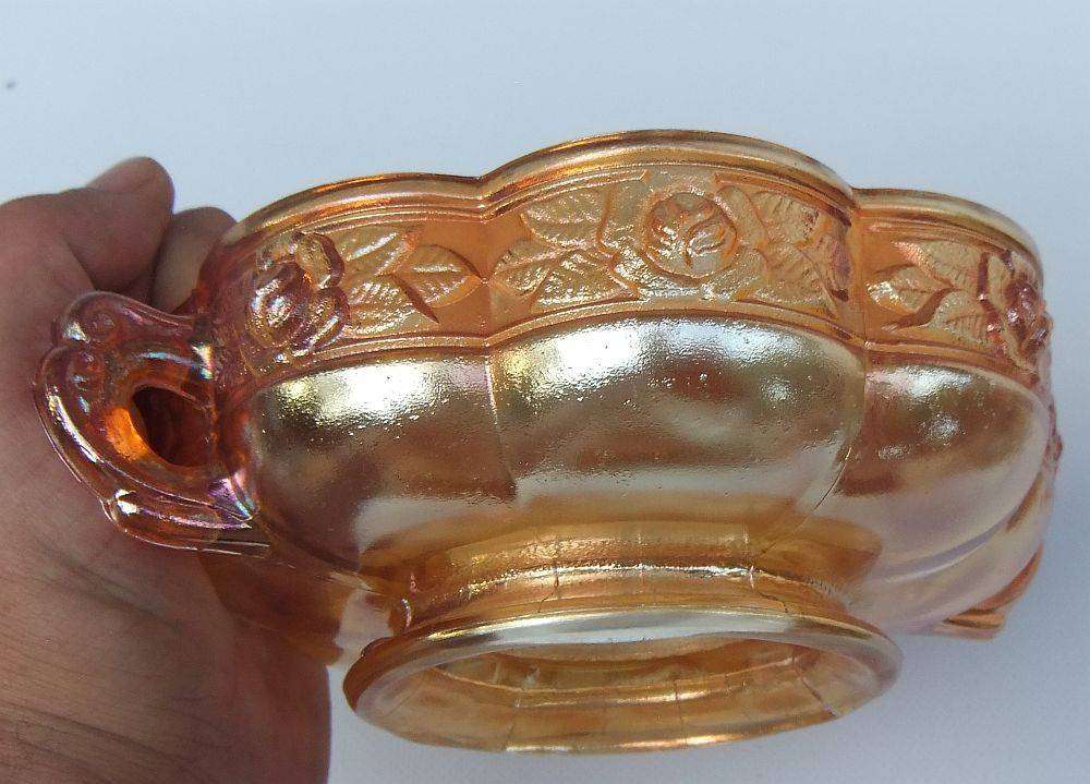 A beautiful old genuine Carnival glass bonbon dish with rose detail