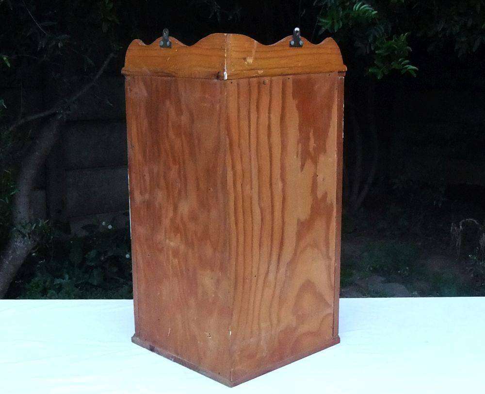 A stunning vintage wooden corner display cabinet with shelving for your collectables