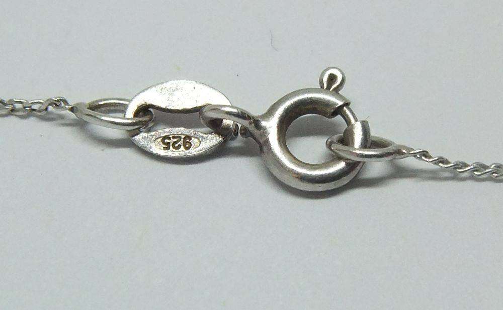 A long sterling silver necklace with a sterling silver crescent moon pendant in great condition