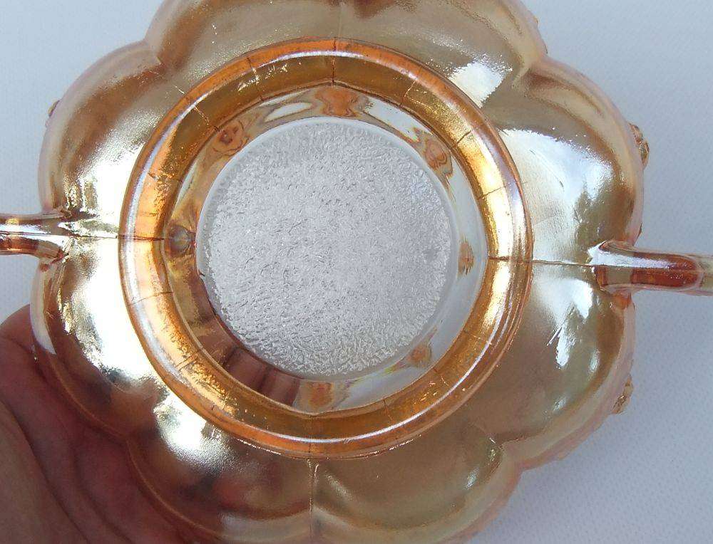 A beautiful old genuine Carnival glass bonbon dish with rose detail