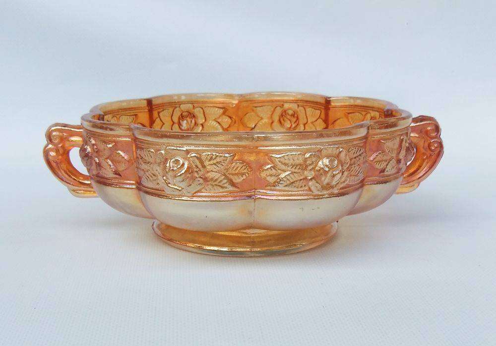 A beautiful old genuine Carnival glass bonbon dish with rose detail