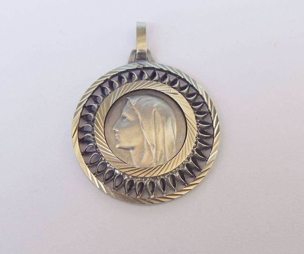 A vintage French made religious icon pendant