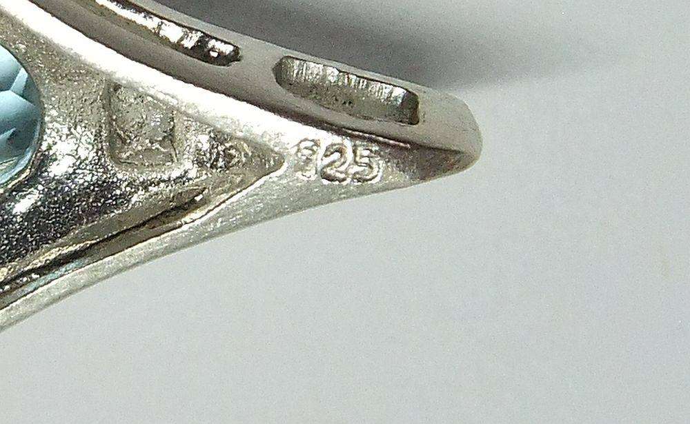 A unique vintage sterling silver pendant with a gorgeous faceted blue inset