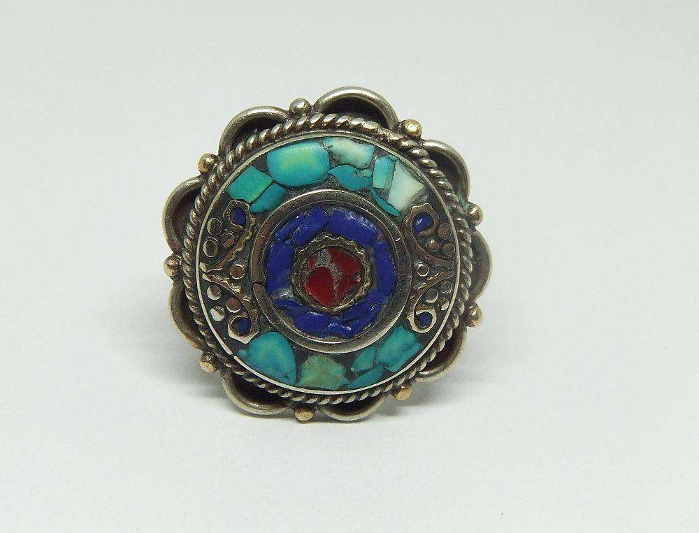 A gorgeous vintage quality Alpacca type white metal ring with various inlayed stones like Turquoise