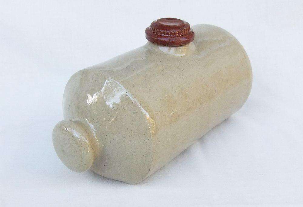 A very old stoneware pottery hot water bottle