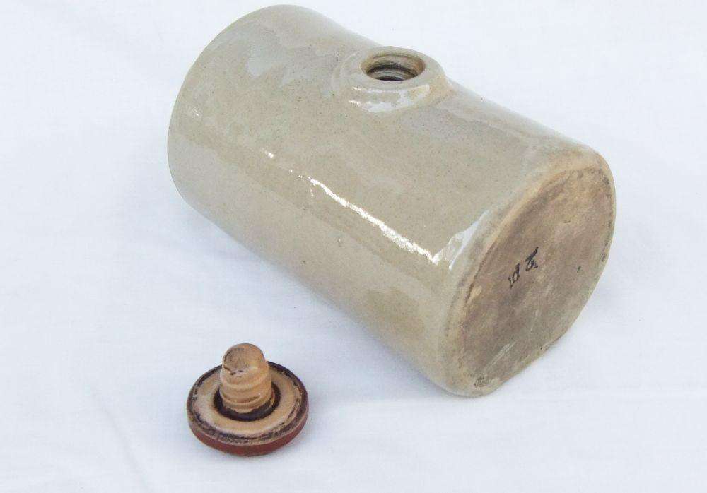 A very old stoneware pottery hot water bottle