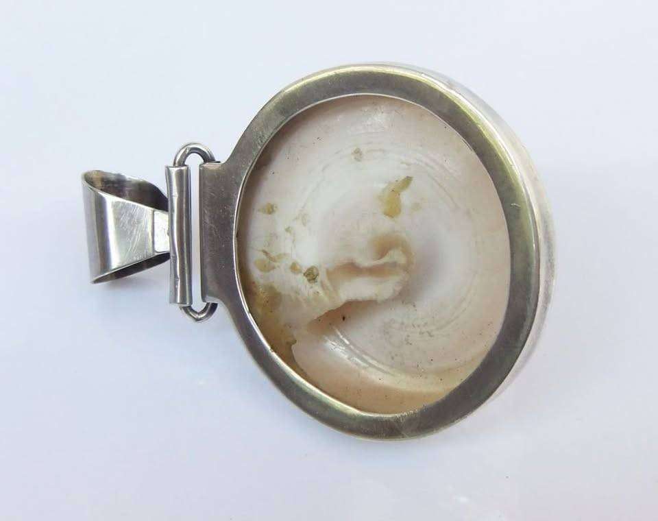 An exquisite unique Throchius Mother of Pearl pyramid top sea shell pendant set in sterling silver