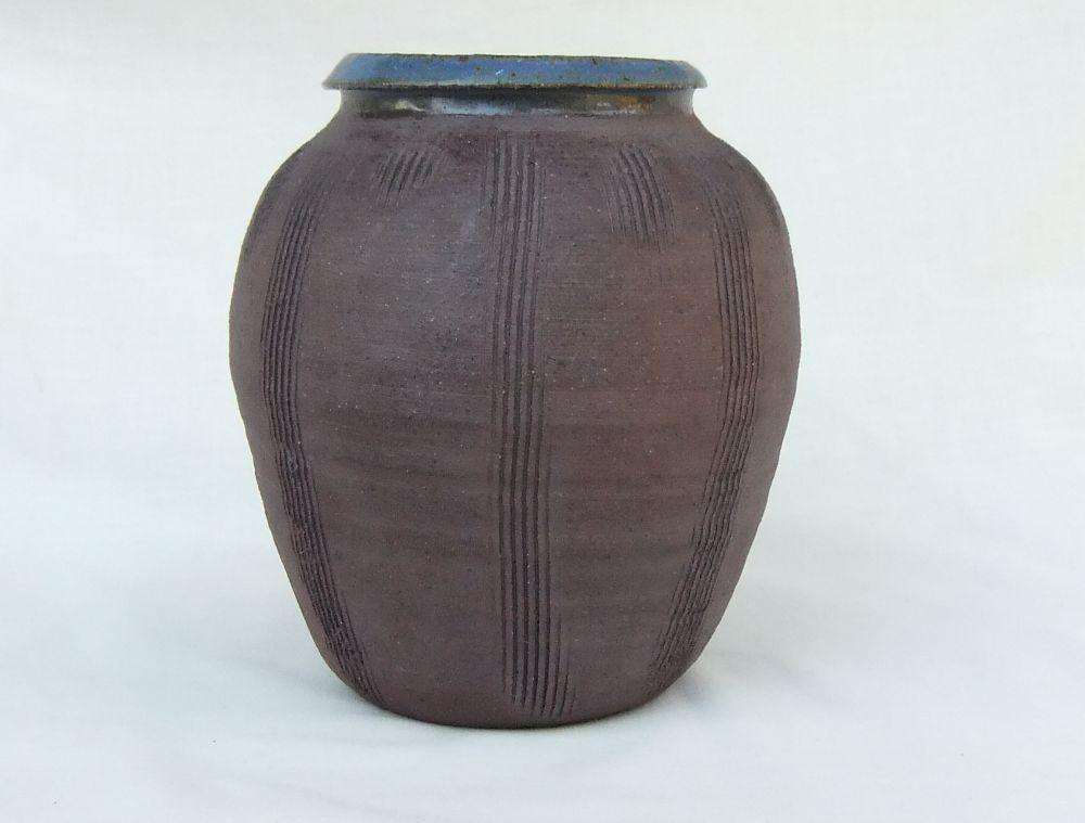 A vintage pottery vase with makers stamp on the base