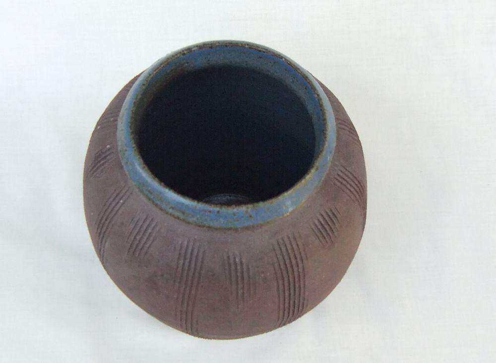 A vintage pottery vase with makers stamp on the base