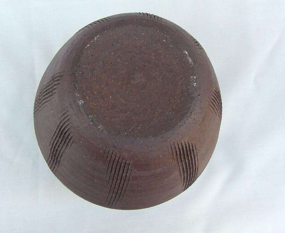 A vintage pottery vase with makers stamp on the base