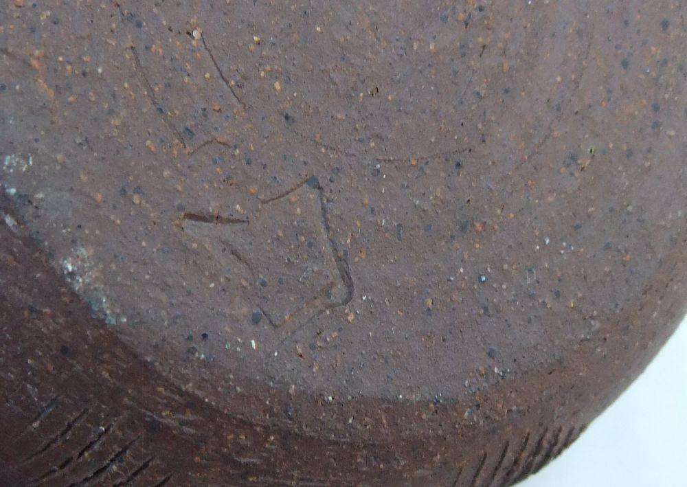 A vintage pottery vase with makers stamp on the base