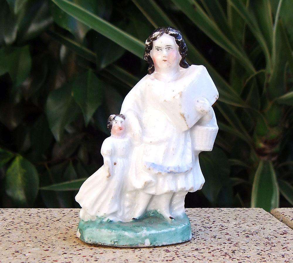 An extremely rare Victorian mother & child porcelain ornament