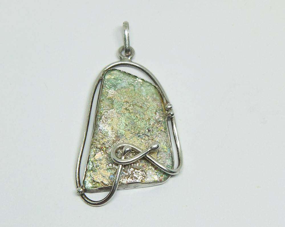 An extremely interesting solid sterling silver pendant set with the most unusual matter