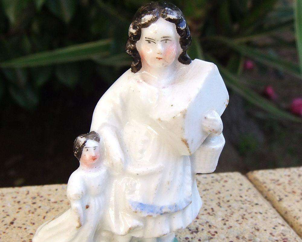 An extremely rare Victorian mother & child porcelain ornament