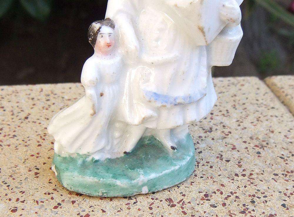 An extremely rare Victorian mother & child porcelain ornament