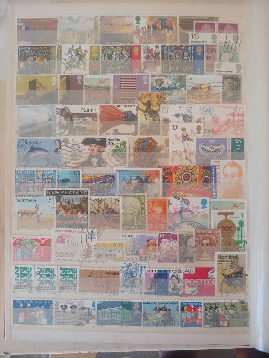 A4 USED LIGHTHOUSE ALBUM LOADED WITH MIXED WORLD STAMPS 16/32 PAGES NOT ALL SHOWN