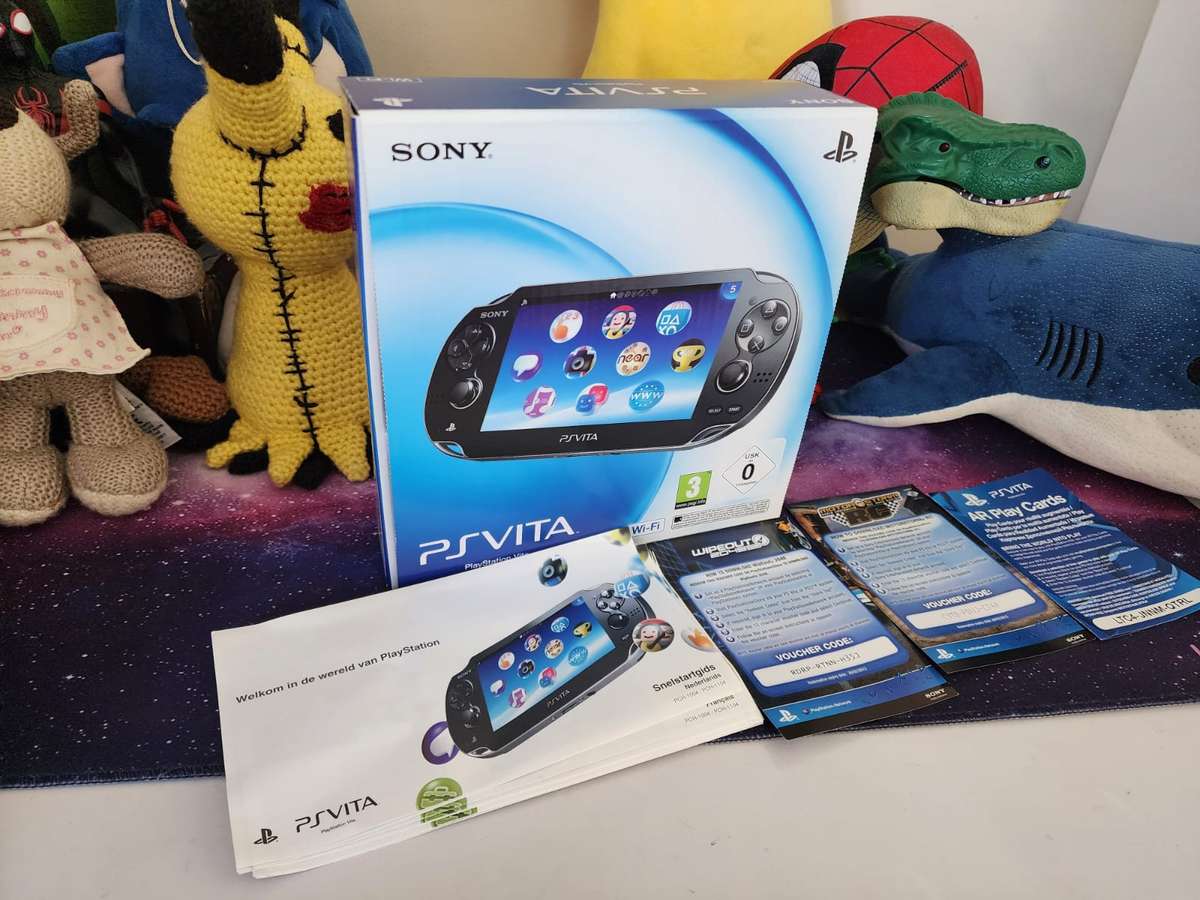 PS VITA WIFI OLED, 2 Games, Original Packaging (Pre-owned)
